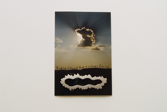 Brooch, ���Every cloud has a silver lining���, on package 1998. silver, � 165,-
